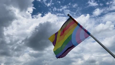 LGBTQ Pride Flag blowing in the wind Видео 253263744