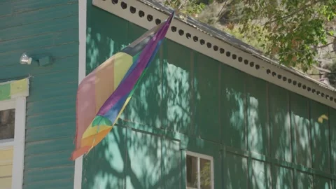 LGBTQ Progress Pride Flag on Green Building Stock Footage 288916451