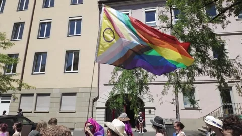 LGBTQ+ rainbow flag waving by the wind at the CSD procession Stock Footage 344754378