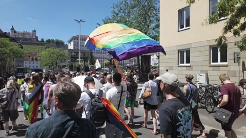 LGBTQ+ rainbow flag waving by the wind at CSD procession Stock Footage 344754716