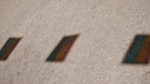 Lgtb flags reflected on the pavement in the Street. Gay Pride Stock Footage 113476058
