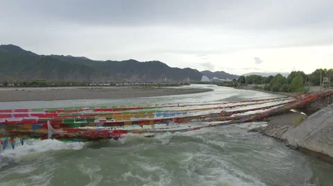 LHASA RIVER PRAYER FLAGS DRONE AERIAL FLYING OVER CHINA TIBET Stock Footage 68199664