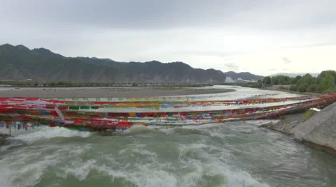 LHASA RIVER PRAYER FLAGS DRONE AERIAL FLYING OVER CHINA TIBET Stock Footage 68202282