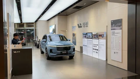 Li Auto store with electric car inside. ... | Stock Video | Pond5