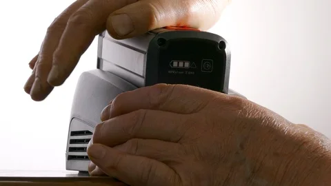 Li-on battery being put into its charger. Stock Footage 114982252