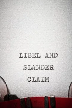 Libel and slander claim text written with a typewriter. Stock Photos