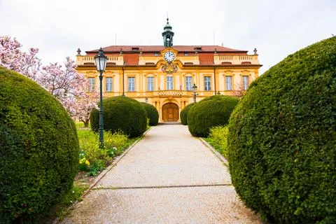 Liben Castle in Rococo style in spring with magnolia tree Stock Photos