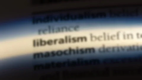 Liberalism word in a dictionary. Stock Footage 99562173