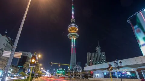 The Liberation Tower timelapse hyperlapse in Kuwait City illuminated at night Stock Photos