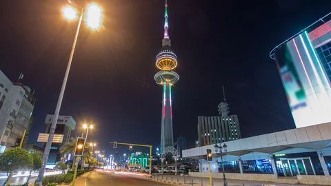 The Liberation Tower timelapse hyperlapse in Kuwait City illuminated at night Stock Photos