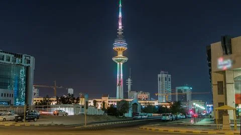 The Liberation Tower timelapse hyperlapse in Kuwait City illuminated at night Stock Photos