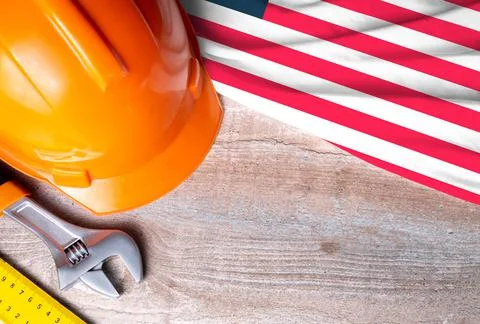 Liberia flag with different construction tools on wood background Stock Photos