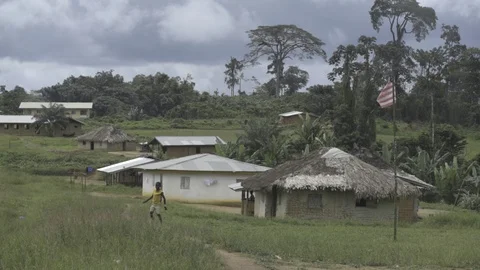 Liberia, Monrovia, boy playing in fields Stock Footage 99050436