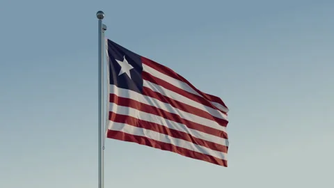 Liberia Monrovia Flag seamless loop Cinematic Realistic Waving Blue Sky Stock Footage 310873883