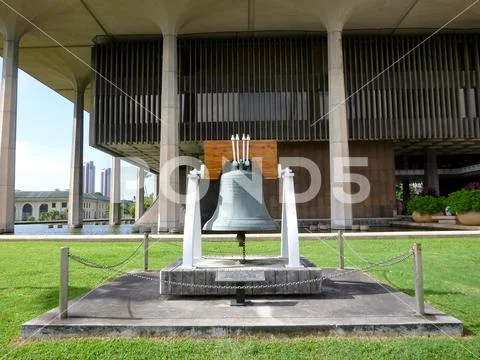 Liberty Bell in front of the Hawaii State Capitol Stock Photos
