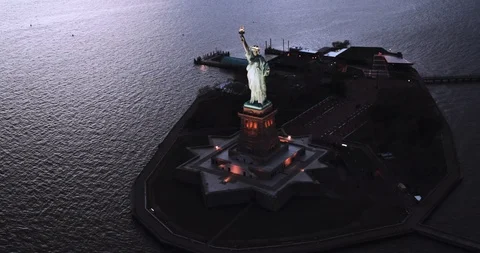 Liberty Island NYC Manhattan, Statue of Liberty aerial cinematic sunset 4K Stock Footage