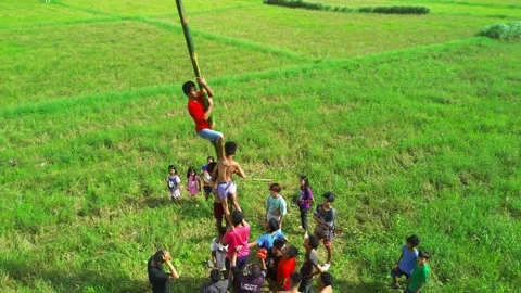 Libmanan, December 11, 2025: Overhead view of childrens in a rural outdoor game. Stock Footage 323682731