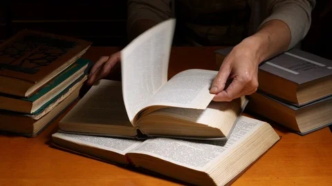 Librarian over the table turning over the pages Stock Footage 92961547