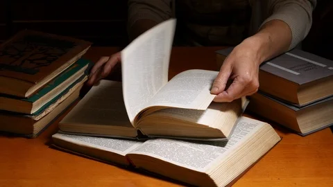 Librarian over the table turning over the pages Stock Footage 92961654