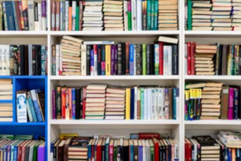 Library with bookcases. Many different books on the shelves. Large selection of Stock Photos
