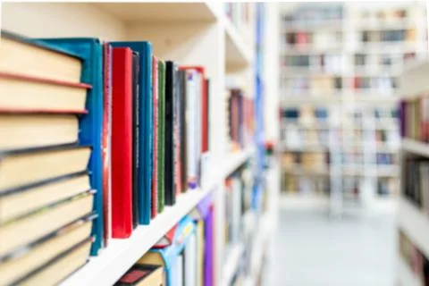 Library with bookcases. Many different books on the shelves. Large selection of Stock Photos