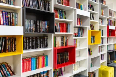 Library with bookcases. Many different books on the shelves. Large selection of Stock Photos