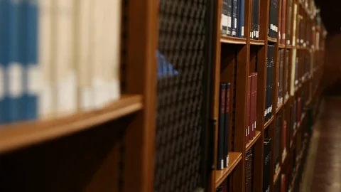 Library Books On Shelf Tracking Stock-Footage 102147582