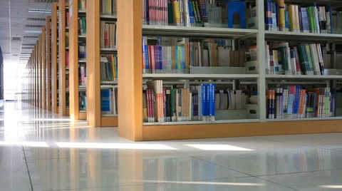 Library bookshelves tracking shot Video stock 54054053