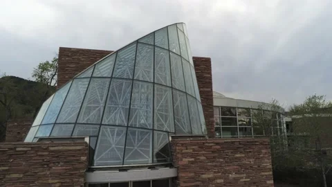 Library by Flatirons - Drone camera moves to front and above to see mountains Stock Footage 138874523