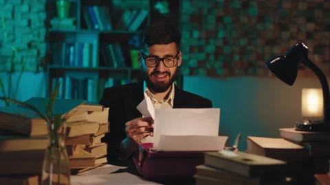 In the library guy student of the history doing his project using a old Video stock 144214476