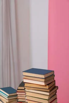 Library learning science stack of books on a white and pink background training Stock Photos