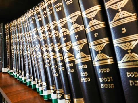 Library in the synagogue. Multi-colored books on the bookshelf in the library Stock Photos