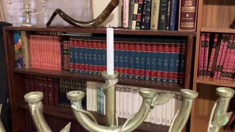 Library in the synagogue Shofar on the shelf. Stock Footage 261331512