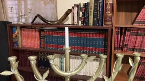 Library in the synagogue Shofar on the shelf. Stock Footage 261331514
