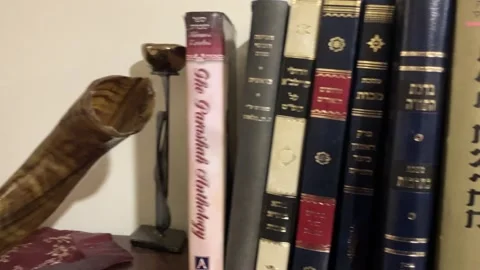 Library in the synagogue Shofar on the shelf. Stock Footage 261331515