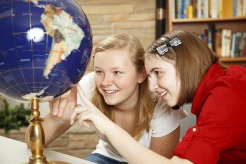 Library Teens Looking at Globe Stock Photos