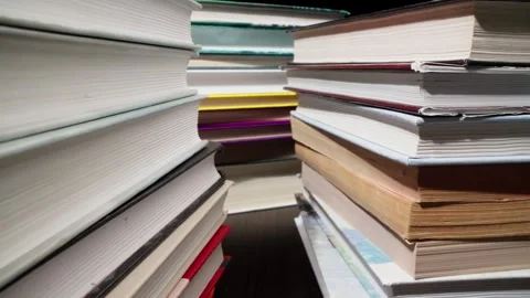Library towers of books. Tower of knowledge. Close-up view of stack of books. Video stock 278033234