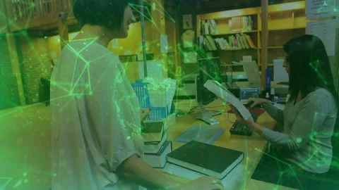 Library user placing book on desk with barcode scanning librarian processing Stock Footage 320089807