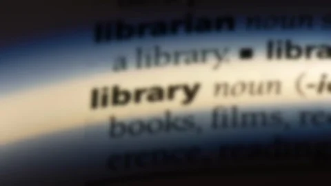 Library word in a dictionary. Stock Footage 99562209