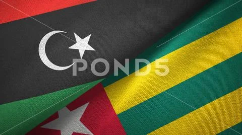 Libya and Togo two flags textile cloth, fabric texture Stock Photos
