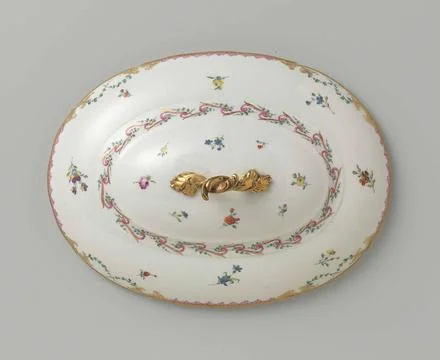 Lid with button, oval of shape, belonging to a tableware with swapped ribb... Stock Photos