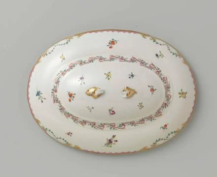 Lid with button, oval of shape, belonging to a tableware with swapped ribb... Stock Photos