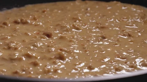 The lid covers the pan in with the mixture of oatmeal, eggs, cheese and milk. Stock Footage 166356410