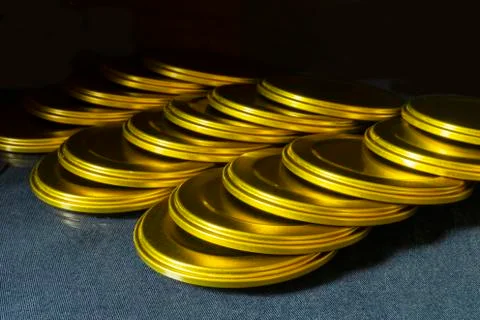 Lid of jar rests upon table close-up gilded colour Stock Photos