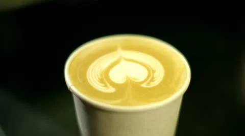 Lid placed on coffee cup with heart pattern Video stock 22254544