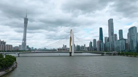 Liede Bridge and Canton Tower beneath heavy cloud cover in Guangzhou Stock Footage 346633226