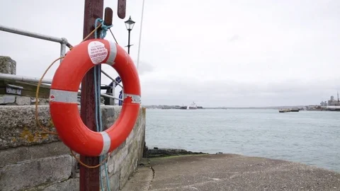 Life buoy at the Portsmouth harbour, England Stock Footage