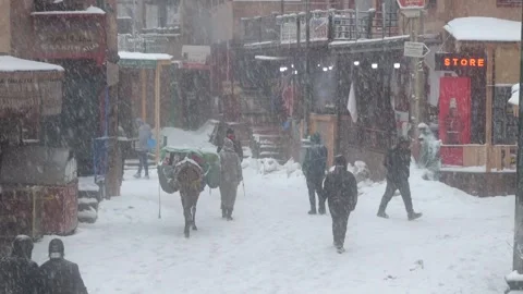 Life during a snow storm in Imlil Town, Morocco. Toubkal National Parc. Video stock 329479201