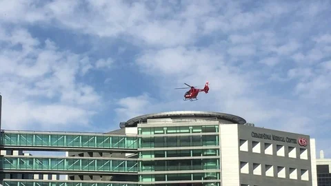 Life Flight helicopter lands on hospital roof Stock Footage