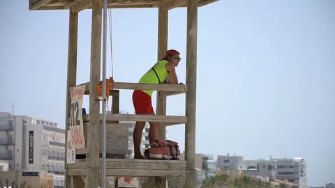 Life guard in beach tower Stock Footage 128349033